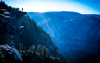 sun shining on mountains