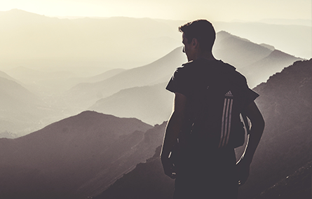 man standing on a mountain